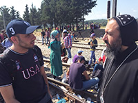 Bishop Angaelos with a refugee