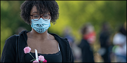 Mourner wearing a Black Lives Matter face mask
