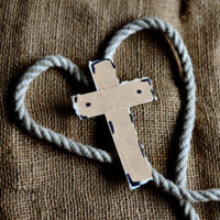 Cross with rope in the shape of a heart